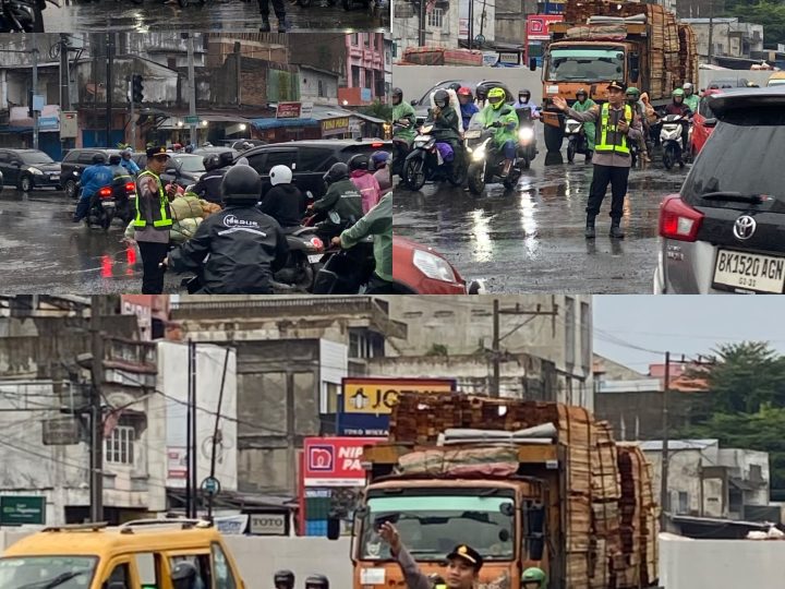 Diguyur Hujan Kapolsek Sunggal Turun Langsung Atur Lalin Pagi,Jalur Medan-Binjai Terpantau Lancar